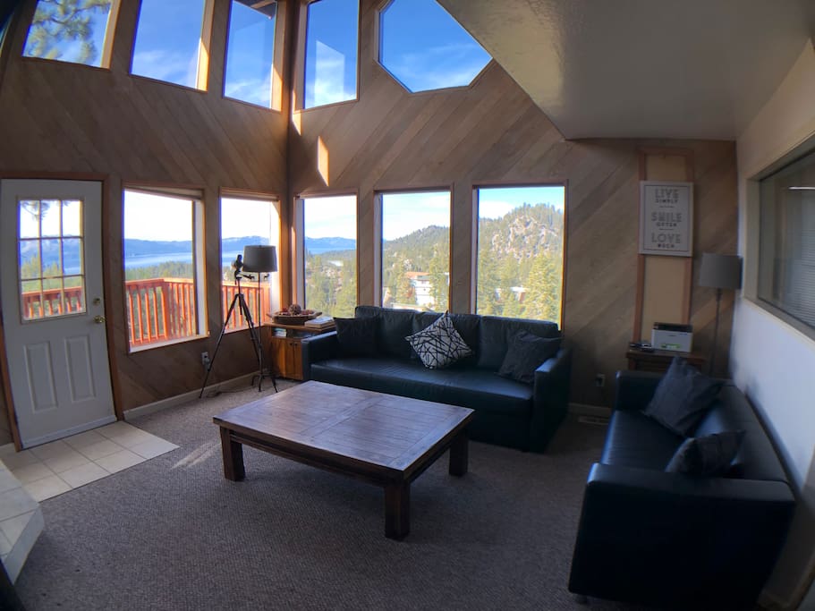 Living room w/lake views, Heavenly views, fireplace, cathedral ceiling, and flatscreen TV