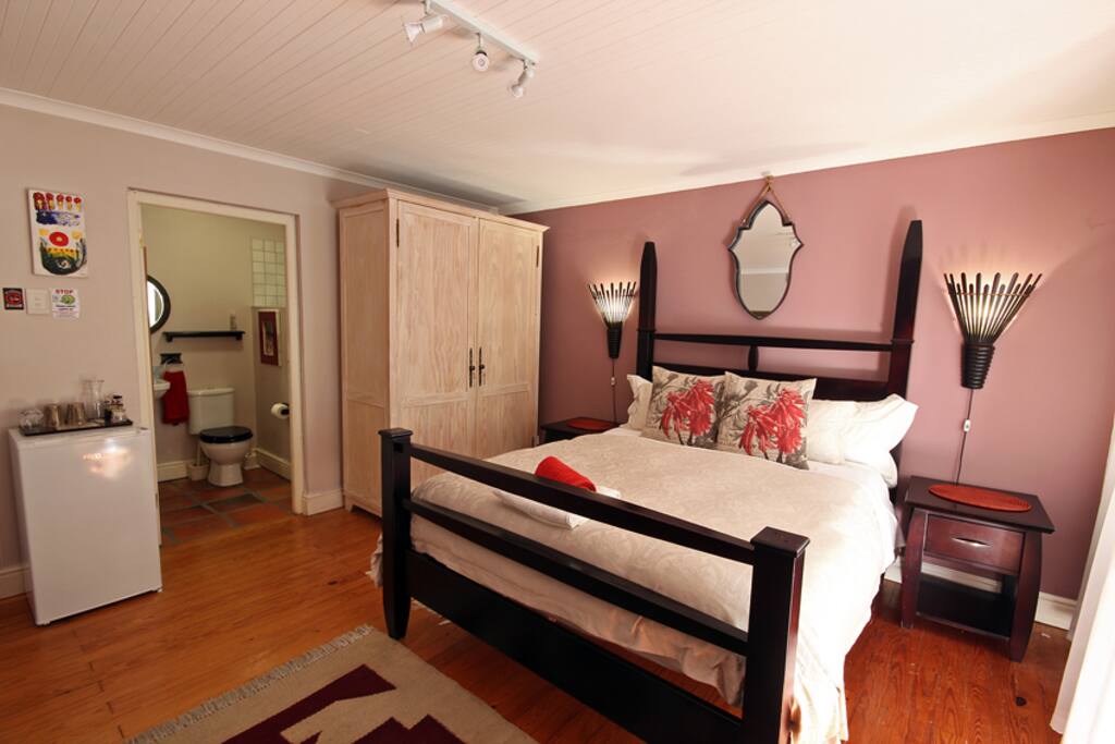 Spacious Room with desk work area, fridge, TV, fan, hair dryer and tea tray