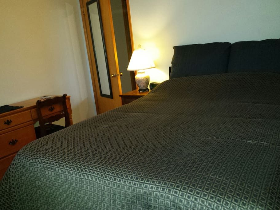 Comfortable full size bed and desk if you have to get some work done