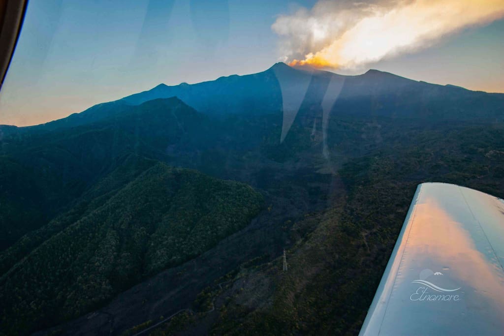 Flying over Valle del Bove where the hot lava flows down during eruptions
