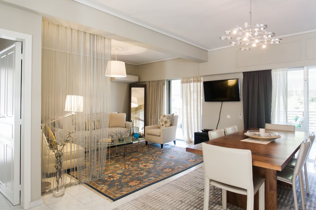 Both dining room and living room open up to the outdoor balcony.