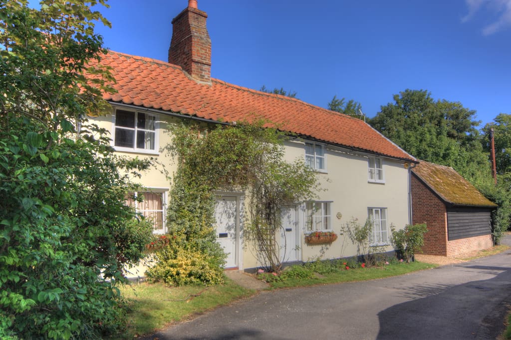 2 Selby Cottage with roses over door, next door is a 2 bed holiday let