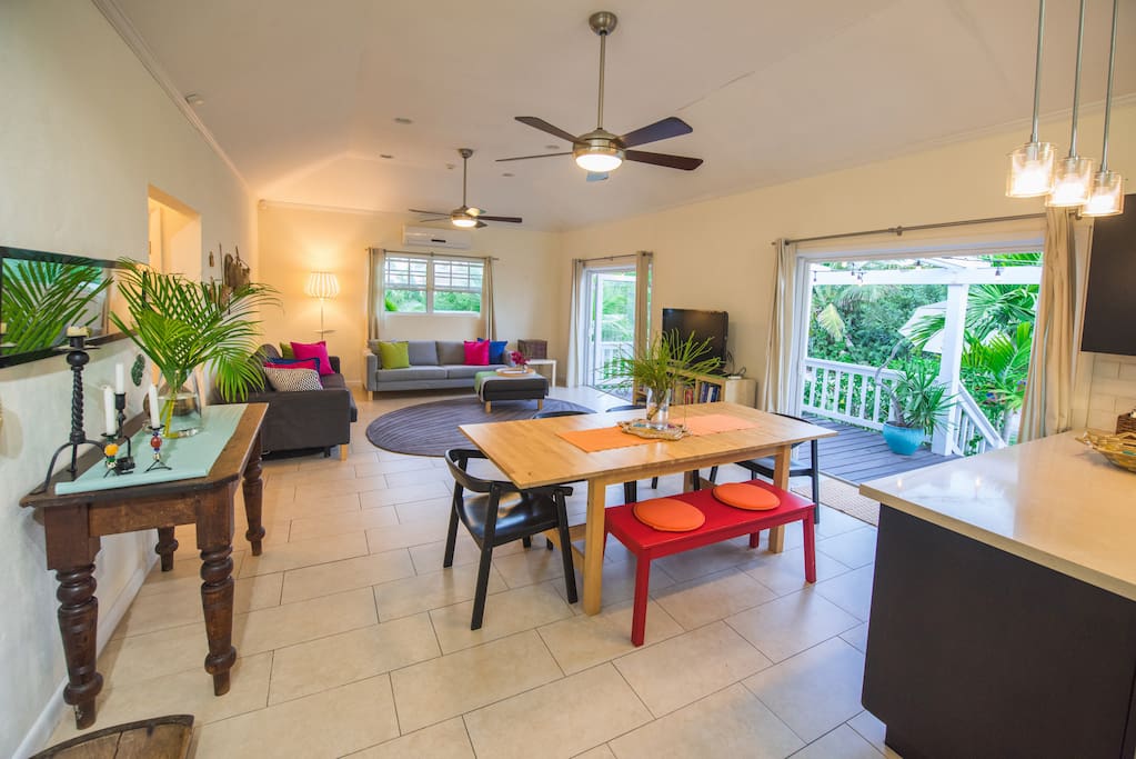The living, dining and kitchen is open plan leading out to the romantic, festive lit porch and outdoor eating area. Individual large a/c unit