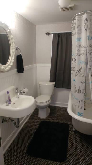 bathroom with refinished claw foot tub