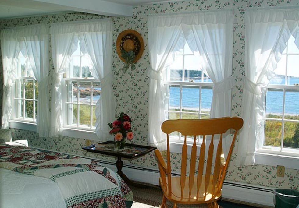 Room S5 in our 1820's farmhouse of Acadia's Oceanside Meadows Inn offers a magnificent view over the ocean, sandy beach and crashing surf and has a queen sized bed and private bathroom with a large corner shower.