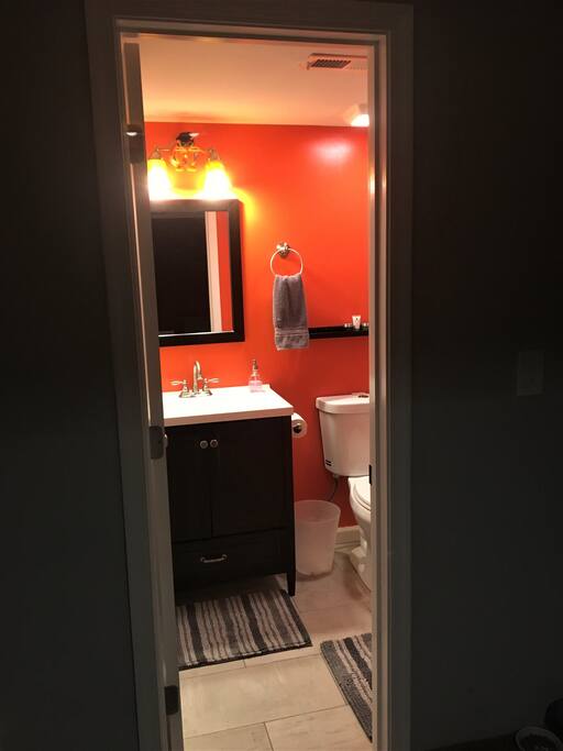 The orange bathroom will wake you up, by force.