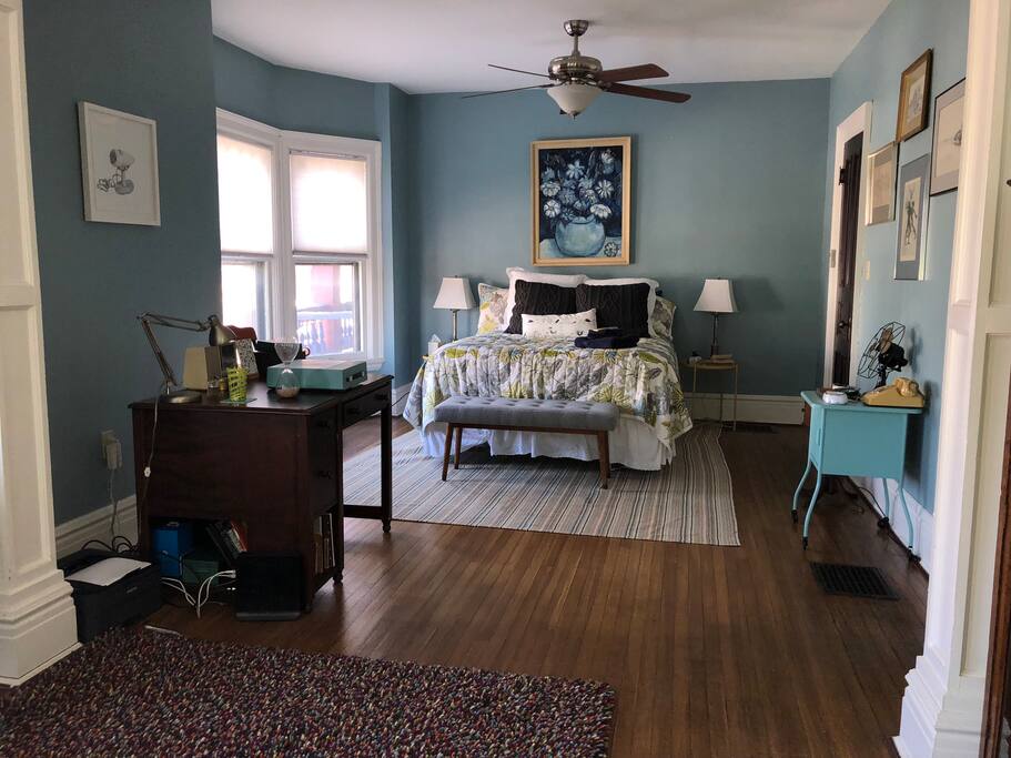 The sleeping section of your large sunny room.
