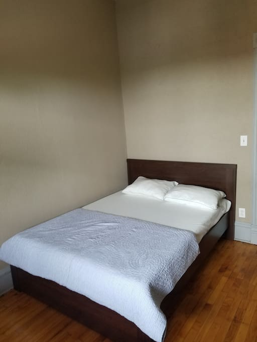 large bedroom with a full-sized bed