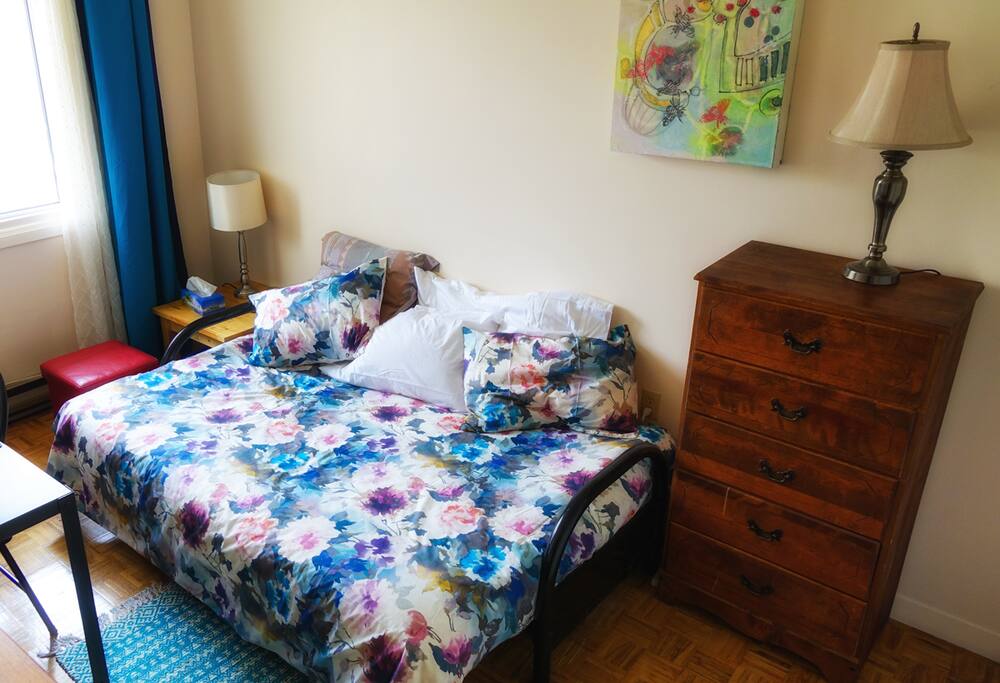 The mattress is a top-of-the-line futon with foam and cotton. It's quite firm and comfortable. The bed can be converted into a couch, though no-one has done this yet.