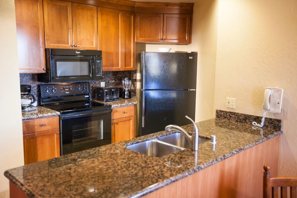 Granite counters in the kitchen. Cooking necessities supplied