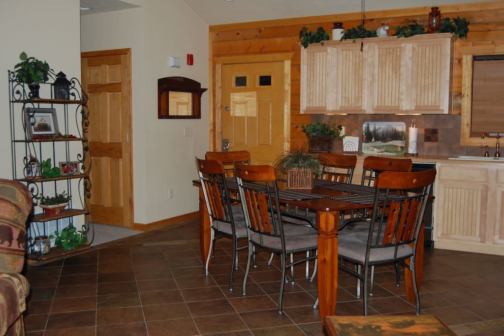 Full size kitchen with plenty of cabinets, counter space & table seating for six