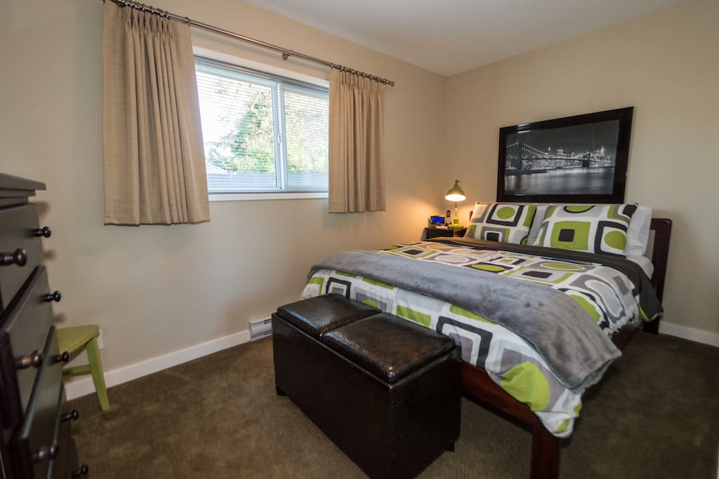 Queen Size Bed and black out drapes in bedroom