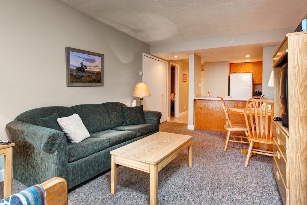 Cozy up on the plush sofa in the living room.