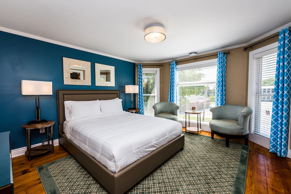 Room 5 - 2nd Floor: features a queen luxury plush mattress set, quality linens, flat panel TV & cable, WiFi, Central A/C, walk-in closet, organizer/storage, swivel chairs, bedside lamps, dressing mirror and fully equipped private ensuite bathroom.