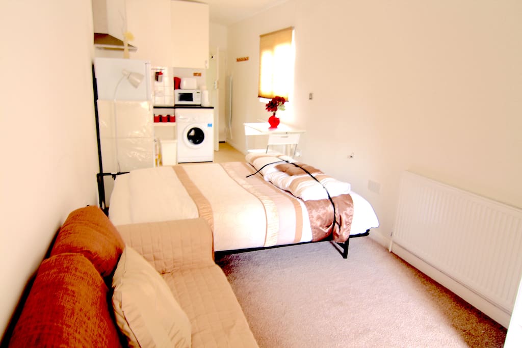 Spacious Lounge sofa and a real bed
