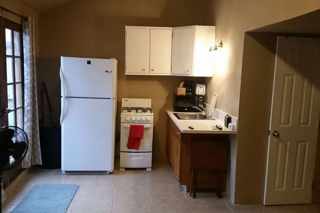 kitchen,microwave,
gas stove,refrigerator.