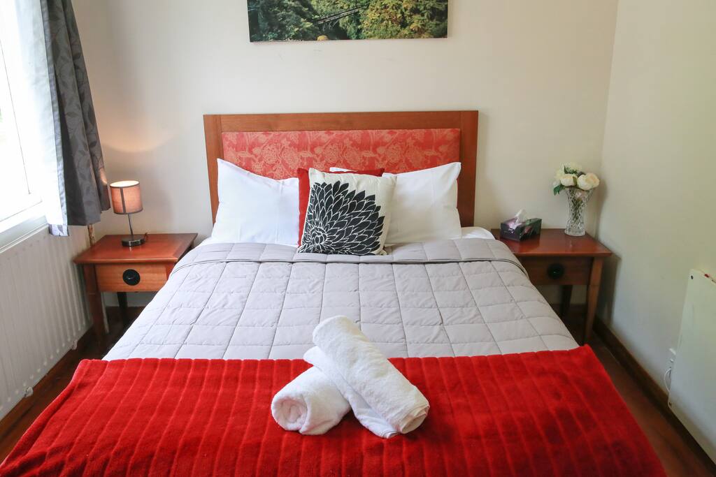 Comfy double bed with garden view.