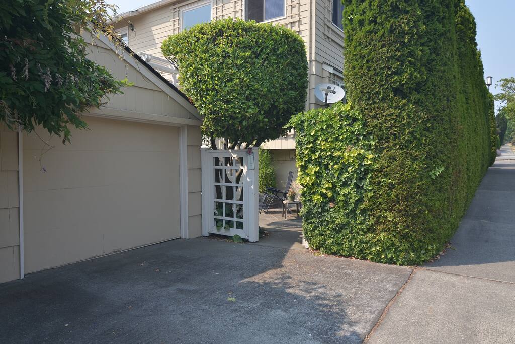 Patio entrance through back gate to the right of the driveway (off of 29th Ave W.)