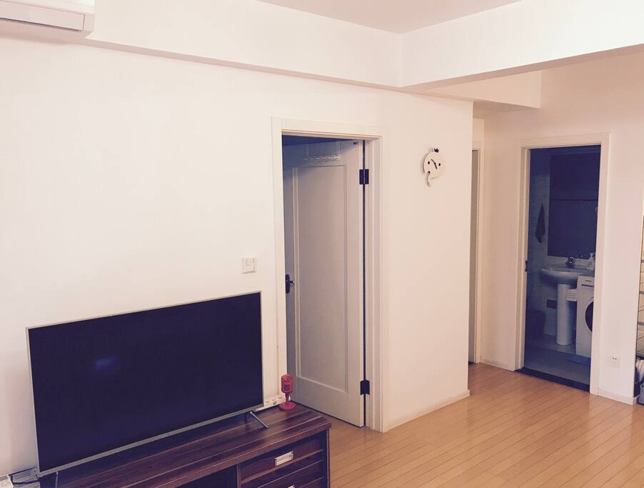 Living room with Xiaomi 49" digital TV to access all of online TV content