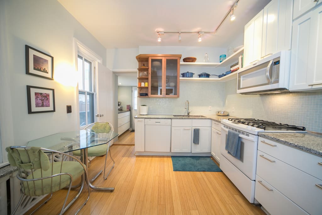 Eat in kitchen w/ vintage 1970's table but otherwise modern appliances including dishwasher, range and subzero fridge