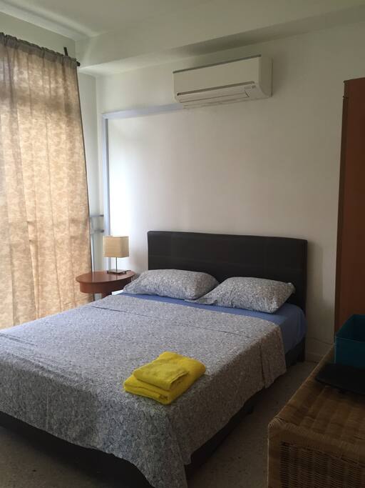 This is your room, with queen size bed, Aircon, dresser, wardrobe and big windows. Clean sheets and towels awaits you.