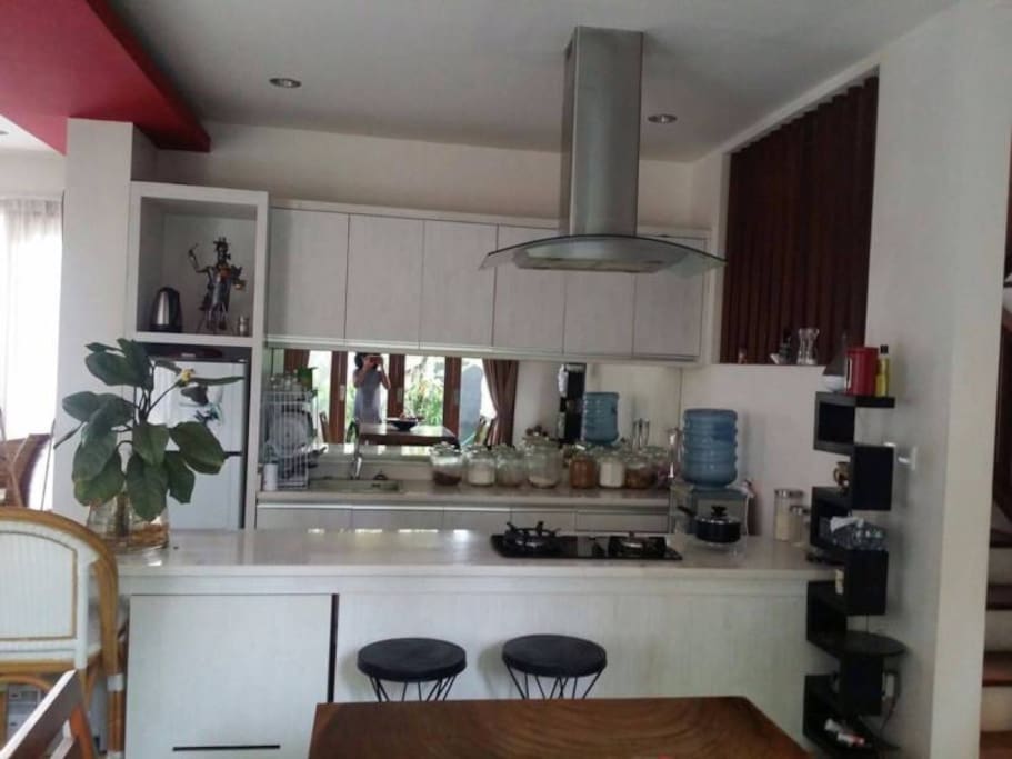Modern kitchen with oven, two fridges and microwave