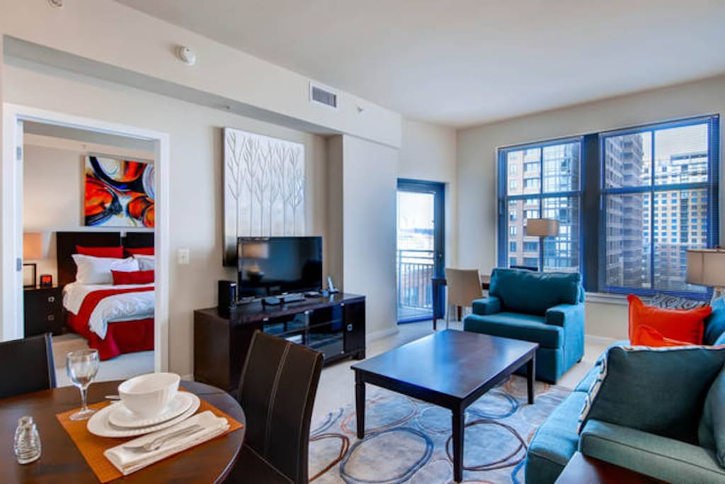Comfortable living room with over-sized windows providing lovely natural light