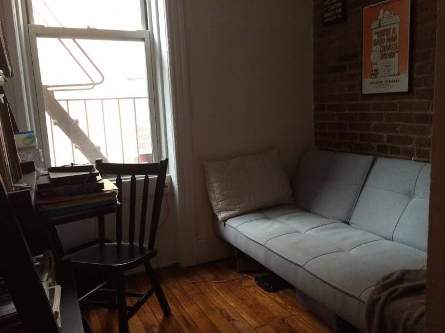 A small study with a couch that turns into an extra bed