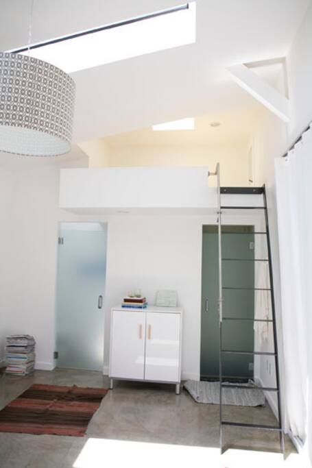 Ladder to the loft bed (shower below). Guests can sleep in loft, which is a queen, or on the sofa which can be a twin or a king.