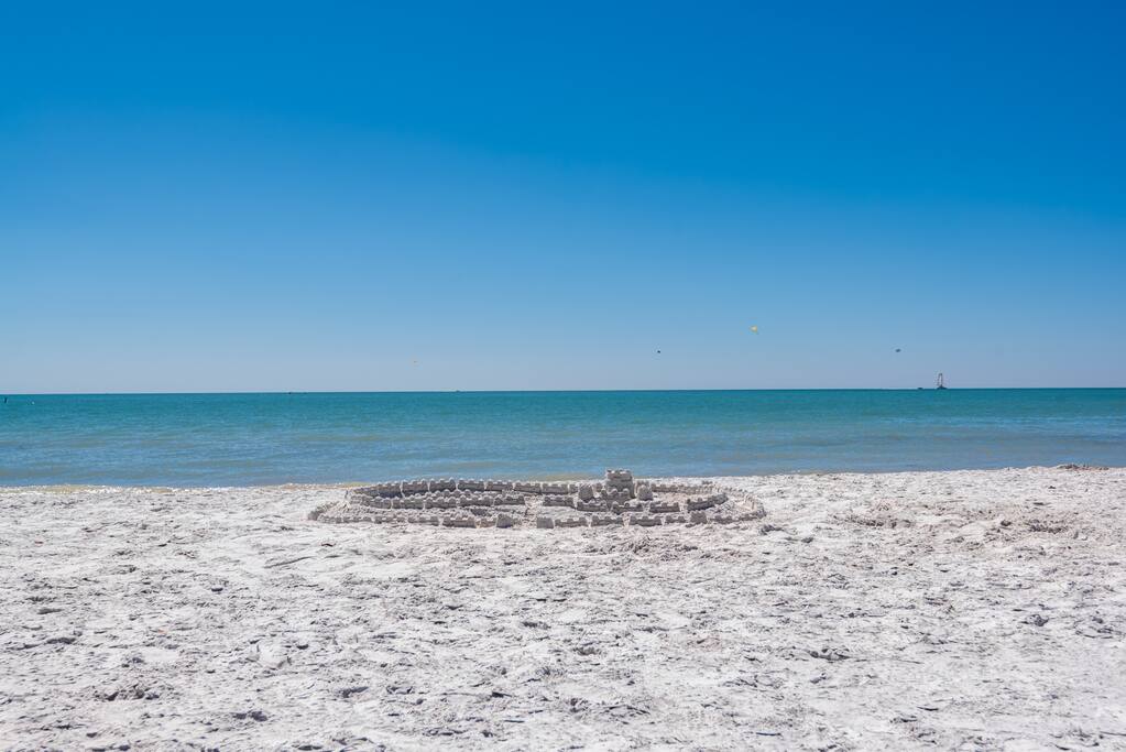 Beautiful turquoise water white sandy beach just a few minutes walk from resort across the street