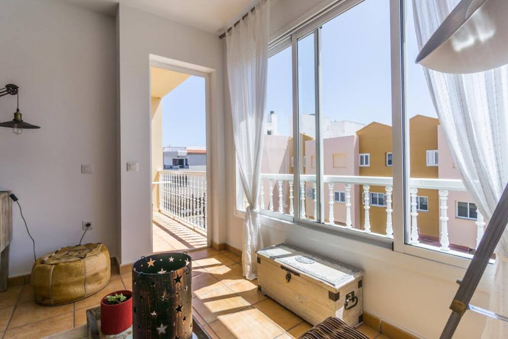 living room with sunny balcony