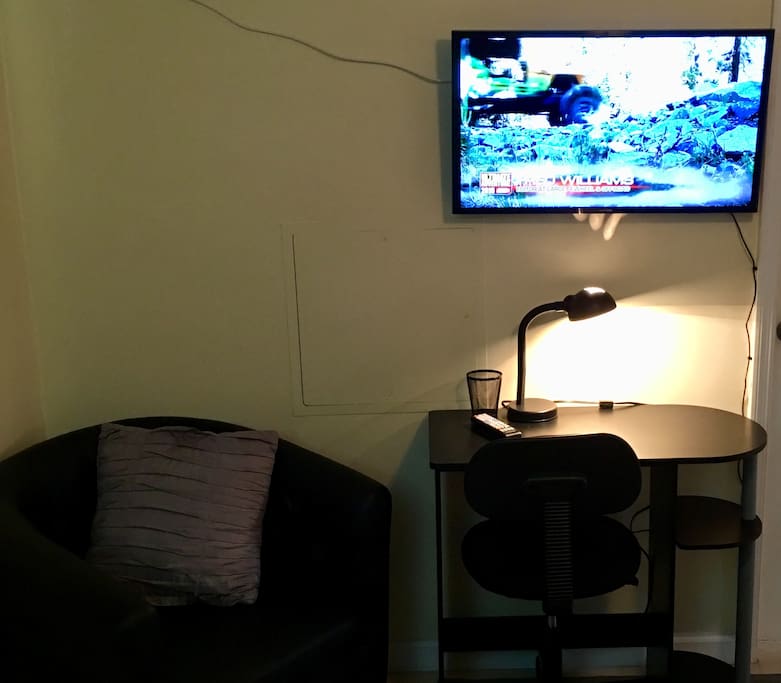 A small computer desk allows you to get some work done! Or, just watch some TV instead ;)