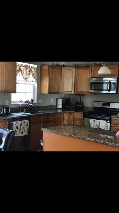 Spacious modern kitchen with upgraded counters, cabinets and appliances