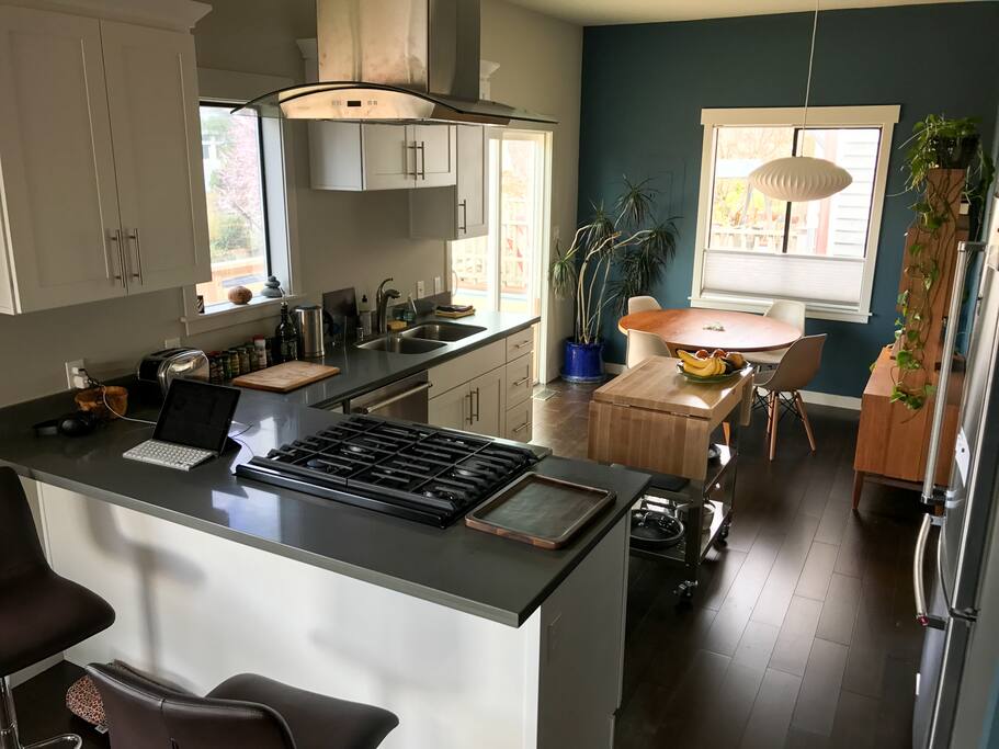 Looking at the kitchen, bar, and dining room