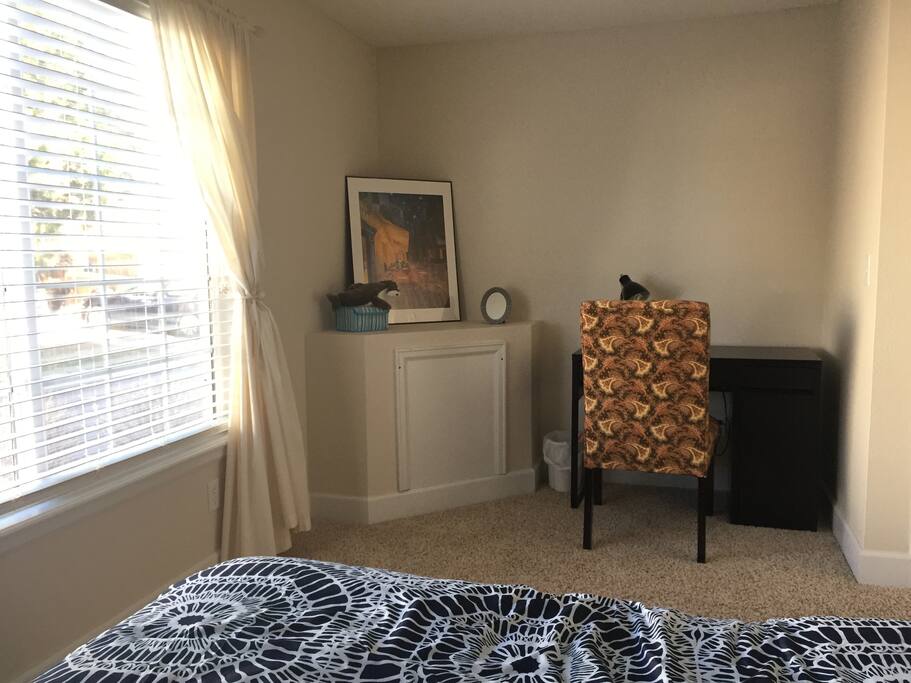 Bedroom with a queen bed and walk-in closet