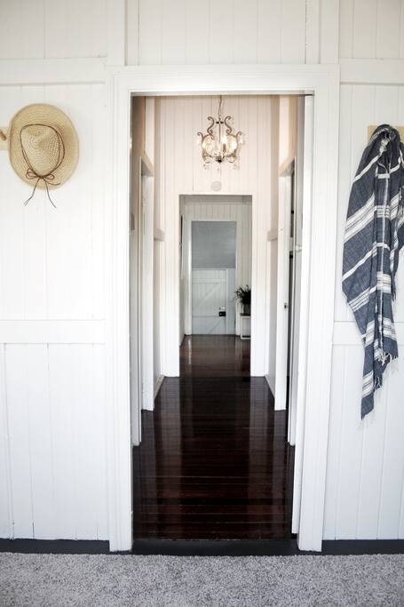Entrance way with high ceilings and original hardwood floor.