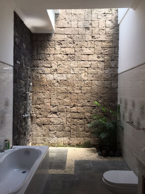 The bathrooms feel "outdoors" but are enclosed. Lovely high ceilings, plants and skylights.