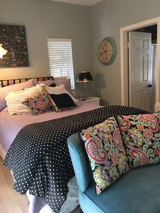 Plenty of light and a small settee at the end of the bed to share while having a glass of wine or just visiting with your loved one. Small but complete! The door leads to a private full bath with fluffy towels, hair dryer and more.