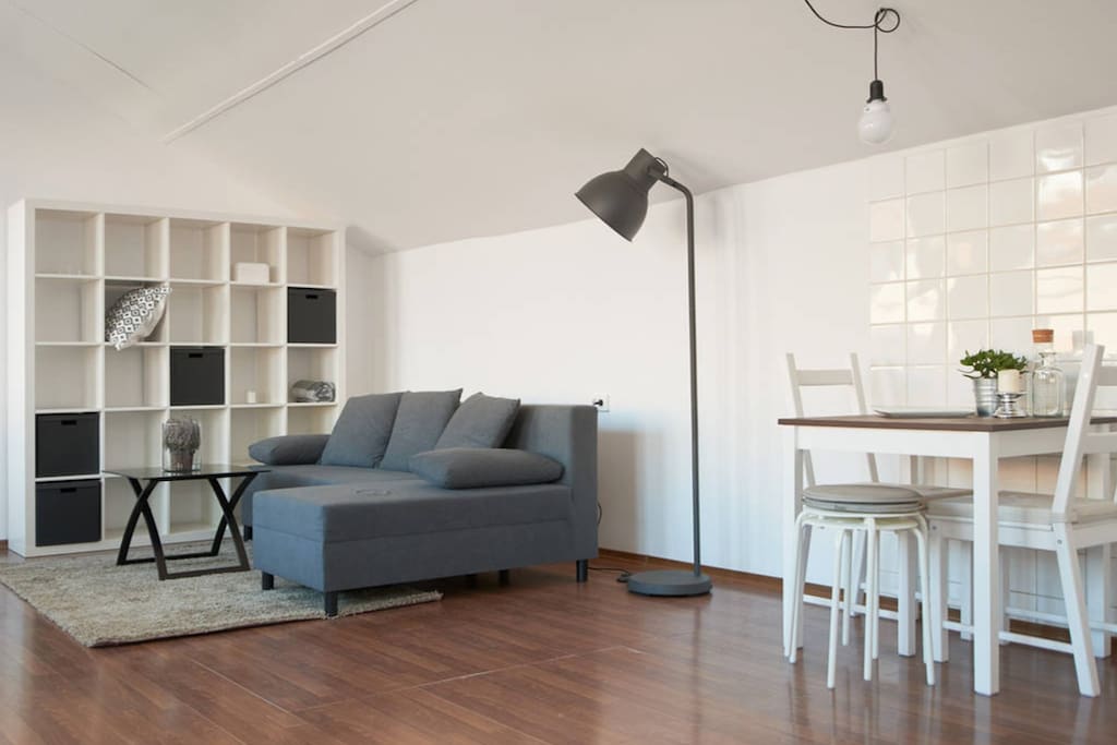 Living room with a new comfortable sofa transforming in an extra double bed