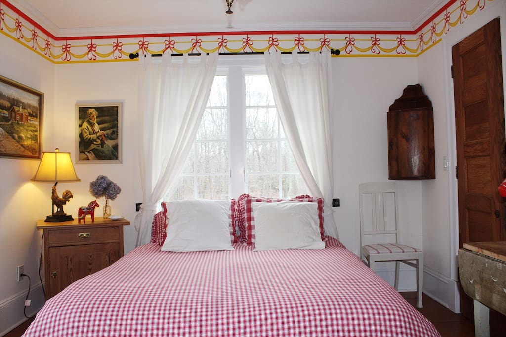 The Red Room. Queen size bed and closet. Shared bathroom located outside this room.