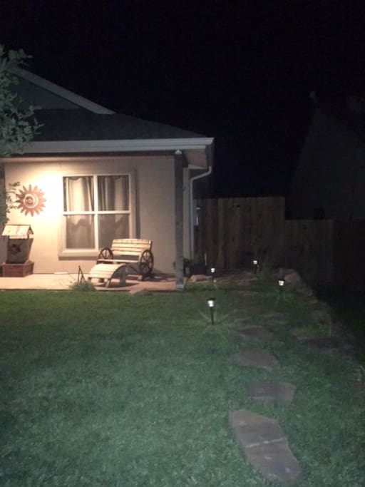 The path to the room is lit with pathway lights and motion sensor spot lights.
