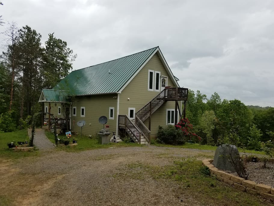 This photo shows the front of the house as well as the apartment stairwell. There is access to the apartment on our main floor where the front door is. In the event the weather is bad do not hesitate to come to the front door instead of trying to get up those stairs without getting soaked!!