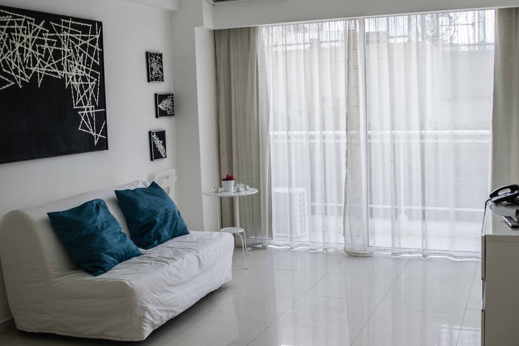 living room equipped with an additional and very comfortable bed sofa