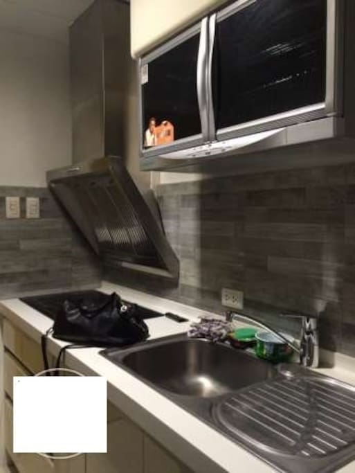 induction cooker with exhaust and hot water in kitchen sink plus high end storage cabinets (push type)