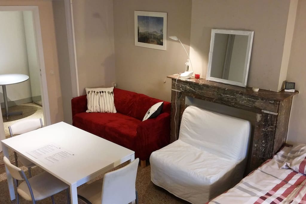 Main room with sofas an dining table