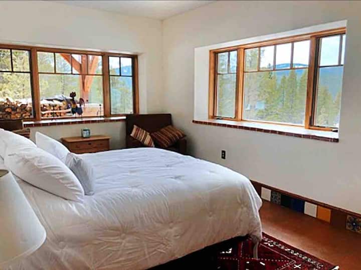 Bottom floor bedroom with queen bed.