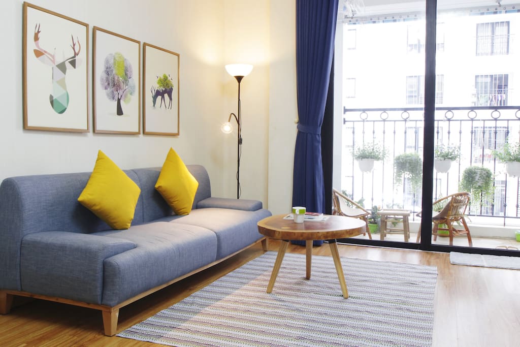 A spacious, modern living room full of light