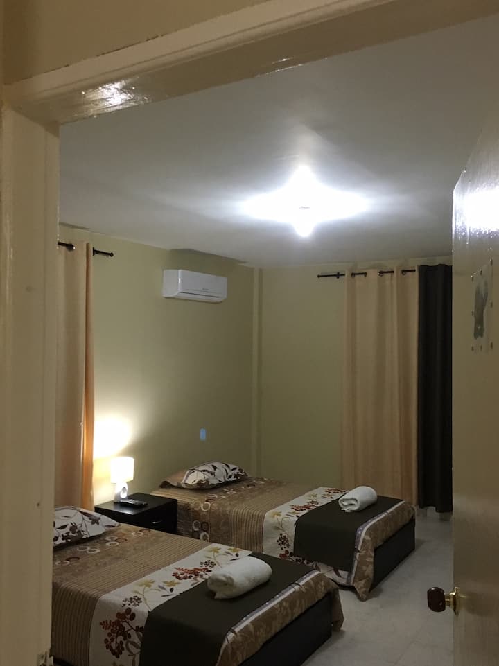 Kamer met drie eenpersoonsbedden
