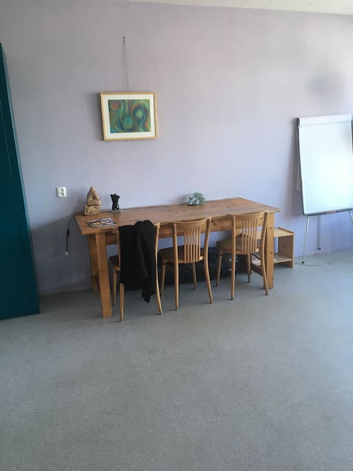 Large dinnertable sits across from the couch in the spacious livingroom.