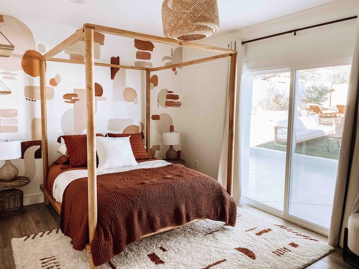 Guest bedroom with private sliding doors out to the backyard. 